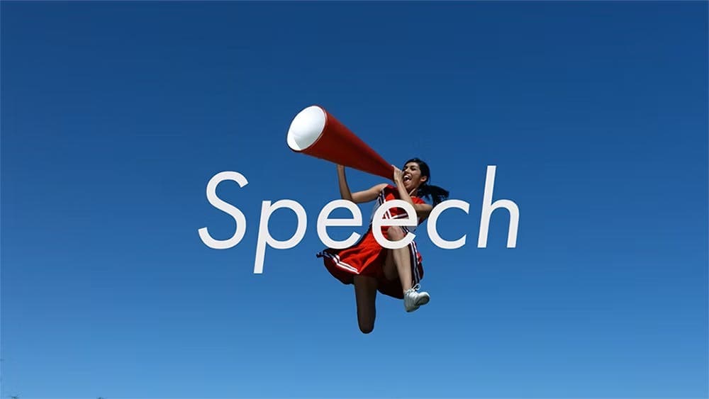 A woman in a red cheerleader outfit jumping behind the word "Speech"